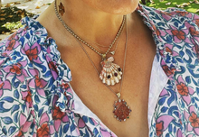 Load image into Gallery viewer, Ruby Halo Lions Paw Pendant in shell by Christina Puchi