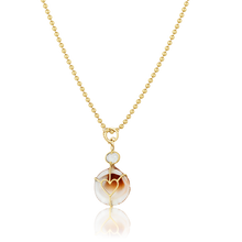 Load image into Gallery viewer, Brown Striped Shell Charm in shell by Christina Puchi