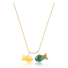 Load image into Gallery viewer, Carved Stone Gold Fish Pendants in carved stone by Christina Puchi