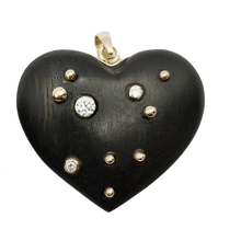 Load image into Gallery viewer, Carved Ebony Studded Heart Pendant in carved wood by Christina Puchi
