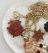 Load image into Gallery viewer, Ruby Halo Lions Paw Pendant in shell by Christina Puchi
