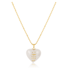 Load image into Gallery viewer, Carved Stone Stitched Heart Pendants in carved stone by Christina Puchi

