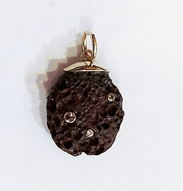 Lava Rock Pendant in shell by Christina Puchi